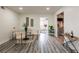 Bright dining area with a glass table, stylish chairs, and modern decor at 202 Cranberry Ln, Brandon, FL 33510