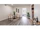Bright dining area with a glass table, stylish chairs, and modern decor at 202 Cranberry Ln, Brandon, FL 33510