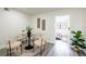 Inviting dining area with modern decor, a round glass table, and stylish chairs at 202 Cranberry Ln, Brandon, FL 33510