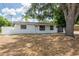 Charming single-story home with a well-maintained front yard and a stone facade at 202 Cranberry Ln, Brandon, FL 33510