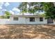 Charming single-story home with a well-maintained front yard and a stone facade at 202 Cranberry Ln, Brandon, FL 33510
