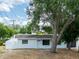 Charming single-story home with a well-maintained front yard and a stone facade at 202 Cranberry Ln, Brandon, FL 33510