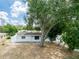 Charming single-story home with a well-maintained front yard and a stone facade at 202 Cranberry Ln, Brandon, FL 33510