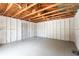 Interior of the detached garage showing painted walls, floor, and utility door at 202 Cranberry Ln, Brandon, FL 33510
