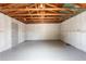 Interior of the detached garage, showing white walls and exposed ceiling rafters at 202 Cranberry Ln, Brandon, FL 33510
