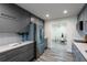 Bright kitchen features gray cabinetry, stainless appliances, white subway tile backsplash and modern countertops at 202 Cranberry Ln, Brandon, FL 33510