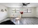 Living room with decorative chairs, area rug, ceiling fan and natural light at 202 Cranberry Ln, Brandon, FL 33510