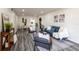 Open-concept living space featuring stylish seating, contemporary decor, and a seamless flow to the dining area at 202 Cranberry Ln, Brandon, FL 33510
