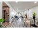 Open-concept living space featuring modern furniture, a dining area, and updated kitchen at 202 Cranberry Ln, Brandon, FL 33510