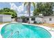 Backyard pool view showcasing clear blue water, deck and backyard at 202 Cranberry Ln, Brandon, FL 33510