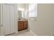 Bathroom features a window, vanity, and a neutral paint palette at 20404 Autumn Fern Ave, Tampa, FL 33647