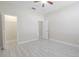 A bright bedroom offers ceiling fan, closet, and neutral paint at 20404 Autumn Fern Ave, Tampa, FL 33647