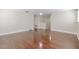 Bonus room featuring wood floors, neutral walls, modern lighting, and natural light at 20404 Autumn Fern Ave, Tampa, FL 33647