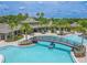 This home boasts access to a magnificent community pool with a bridge, slides, and ample seating areas at 20404 Autumn Fern Ave, Tampa, FL 33647