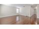 Living room features wood floors, neutral walls, modern lighting and natural light at 20404 Autumn Fern Ave, Tampa, FL 33647