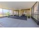 Spacious, screened patio with potted plants and neutral color scheme at 20404 Autumn Fern Ave, Tampa, FL 33647