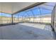 Large screened-in patio with plenty of space for outdoor entertaining at 20404 Autumn Fern Ave, Tampa, FL 33647