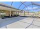This screened-in patio is spacious with room for outdoor furniture and more at 20404 Autumn Fern Ave, Tampa, FL 33647