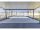 Spacious screened-in patio with concrete flooring and views of the backyard at 20404 Autumn Fern Ave, Tampa, FL 33647