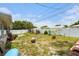 Backyard with some vegetation and a privacy fence at 2078 Shadow Ln, Clearwater, FL 33763