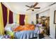 Cozy bedroom featuring dual windows, ceiling fan, and ample space for relaxation at 2078 Shadow Ln, Clearwater, FL 33763
