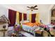 Cozy bedroom featuring dual windows, ceiling fan, and ample space for relaxation at 2078 Shadow Ln, Clearwater, FL 33763