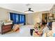 Bright living room with blue curtains and a view to other rooms at 2078 Shadow Ln, Clearwater, FL 33763