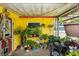 Enclosed patio with plants and outdoor seating at 2078 Shadow Ln, Clearwater, FL 33763