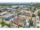 Aerial view showing townhomes near green spaces, shopping, and waterfront views at 2305 Victoria Gardens Ln, Tampa, FL 33609