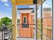 Charming balcony view of a neighborhood with vibrant buildings under a sunny sky at 2305 Victoria Gardens Ln, Tampa, FL 33609