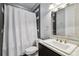 Contemporary bathroom featuring modern fixtures, a white sink, and decorative mirror at 2305 Victoria Gardens Ln, Tampa, FL 33609