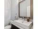 Clean bathroom featuring a square sink, chrome fixtures, and modern design at 2305 Victoria Gardens Ln, Tampa, FL 33609