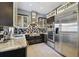 Sleek kitchen featuring stainless steel appliances, stylish backsplash, and modern cabinetry at 2305 Victoria Gardens Ln, Tampa, FL 33609