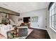 Spacious living room with hardwood floors, modern decor, and a cozy seating area at 2305 Victoria Gardens Ln, Tampa, FL 33609