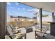Inviting rooftop deck with comfortable seating, fire pit, and views of surrounding buildings and palm trees at 2305 Victoria Gardens Ln, Tampa, FL 33609