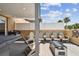 Relaxing rooftop deck featuring lounge chairs, a modern fire pit, and partial views of the neighborhood at 2305 Victoria Gardens Ln, Tampa, FL 33609