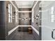 Detailed shot of the stunning glass shower with gray and white tiles and a built-in bench at 2305 Victoria Gardens Ln, Tampa, FL 33609