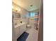 Bathroom with a white vanity, shower, and tub with modern fixtures at 2360 World Parkway Blvd # 36, Clearwater, FL 33763