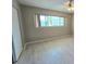 Cozy bedroom with neutral color scheme and wood-look flooring at 2360 World Parkway Blvd # 36, Clearwater, FL 33763