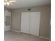 Bedroom offers ample closet space and a mirrored door at 2360 World Parkway Blvd # 36, Clearwater, FL 33763