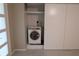 Closet with dryer and sliding doors offers practical laundry convenience at 2360 World Parkway Blvd # 36, Clearwater, FL 33763