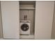 Washer closet with sliding doors offers practical laundry convenience at 2360 World Parkway Blvd # 36, Clearwater, FL 33763