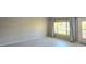 Bright, open living area with lots of natural light, a neutral palette and wood look floors at 2360 World Parkway Blvd # 36, Clearwater, FL 33763
