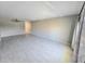Spacious living room with a ceiling fan, neutral walls and flooring, with natural light at 2360 World Parkway Blvd # 36, Clearwater, FL 33763