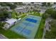 Aerial view of blue and green tennis courts with landscaping and other community amenities at 2360 World Parkway Blvd # 36, Clearwater, FL 33763