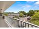 Balcony view overlooking parking and lush greenery for a serene setting at 2426 Persian Dr # 52, Clearwater, FL 33763