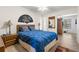 Charming bedroom featuring a ceiling fan and tasteful decor. Hardwood floors and a comfortable bed at 2426 Persian Dr # 52, Clearwater, FL 33763