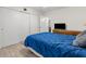 Comfortable bedroom features hardwood floors, a ceiling fan, and ample closet space; ideal for relaxation at 2426 Persian Dr # 52, Clearwater, FL 33763