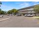 Spacious parking lot with well-maintained building and ample green space at 2426 Persian Dr # 52, Clearwater, FL 33763