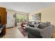 Inviting living room with natural light, plush sofa, and stylish decor at 2426 Persian Dr # 52, Clearwater, FL 33763
